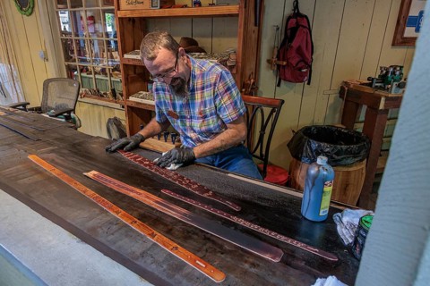 Craftsman demonstrated the art of belt making in Smoky Creek Leather and Hat Company at the