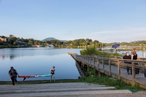 Women take a wake board out of the lake at Lake Junaluska, North Carolina