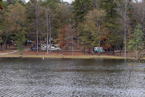 Modern and retro recreational vehicles at the campground near the shore of Ivy Lake in Clarko State