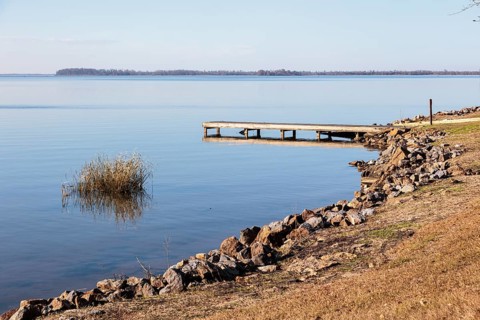 Small wooden dock and boat ramp on Lake Seminole at the Corps of Engineers Eastbank Campground near