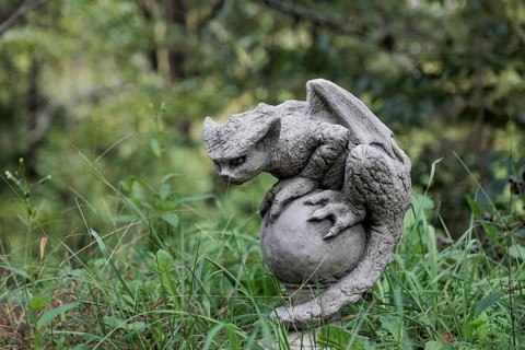 Sculpture of a gargoyle like mythical creature near the entrance to Dismals Canyon near Phil