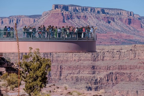 Visitors view the Grand Canyon from the Skybridge, a glass floored bridge extending 70 feet over