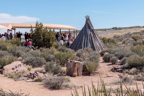 Native American cultural exhibits near the covered bus boarding area at the Eagle Point area of