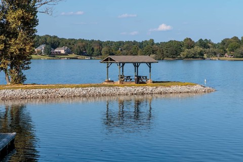 Pavilion with picnic tables on a peninsula at Beech Lake reservoir in Lexington, Tennessee