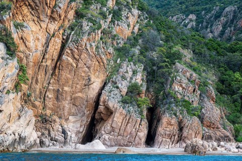 Rock formations and deep blue water, Capo Rosso, Gulf of Porto, Corsica, France