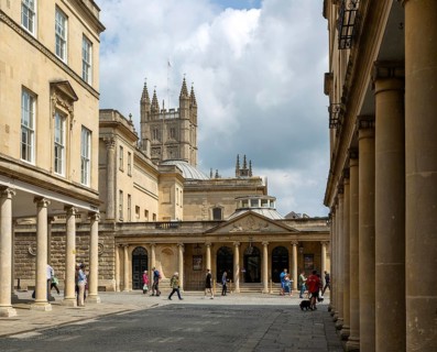 Georgian style buildings with colonnades, Bath Street, city of Bath, north east Somerset, England,