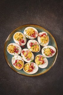 Spicy, stuffed ramen eggs, with bacon and green onions, homemade, no people
