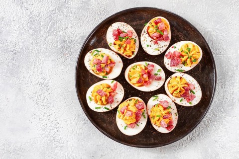 Spicy, stuffed ramen eggs, with bacon and green onions, homemade, no people