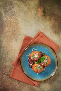 Crispy Arancini appetizer, with parmesan cheese and microgreens, plate, tomato sauce, homemade, no