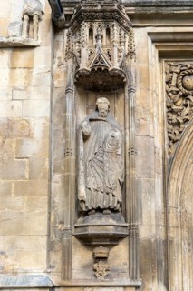 Carved stonework statue of Saint Peter, front of Abbey church, city of Bath, north east Somerset,