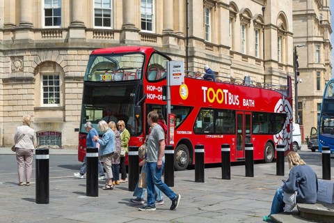 Tootbus Bath open top double-decker tour bus, High Street, city of Bath, north east Somerset,