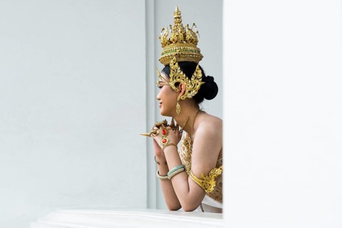 Thai traditionally and festively dressed young woman, Wat Pho, Bangkok, Thailand