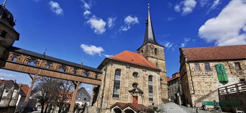 The Protestant-Lutheran St Laurentius Church with the bridge leading to the castle in Thurnau,