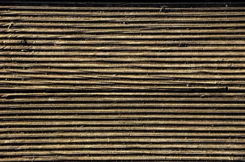 Fluted wood structure, parallel grooves in a wooden surface