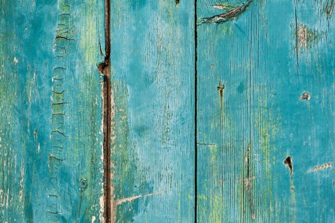 Old wooden door with peeling paint, texture, background, Montenegro, Balkans
