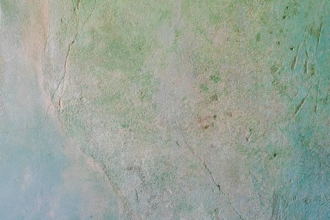 Greenish, cracked wall with rough texture and abstract appearance, background, texture,