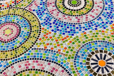 Floor covering decorated with small, colorful stone tiles, Buddhist temple complex Wat Phra That