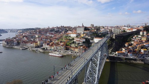View from above of the metal bridge Ponte dom Luis across the Douro in Porto of a city with bridge