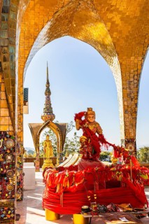 Round arch pavilions decorated with colorful mosaics and glass works of art, including a gilded