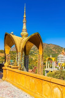 Round arch pavilion decorated with colorful mosaics and glass works of art, Wat Phra That Sorn Kaew
