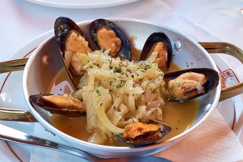 Tasty seafood platter with mussels and aromatic herbs in an elegant restaurant, Hotel Europa,