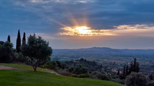 View of a quiet landscape with illuminated sky and vegetation at dusk, Hotel Europa, garden