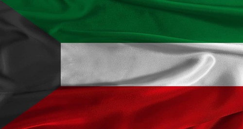 Flag of Kuwait with fabric textured background. Close up of National flag of Kuwait with realistic