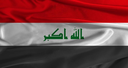 Flag of Irak with fabric textured background. Close up of National flag of Irak with realistic