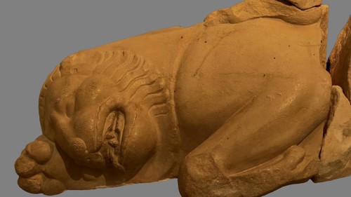 Killed Nemean lion, statue detail of a lying lion, stone texture and fine details, Olympia