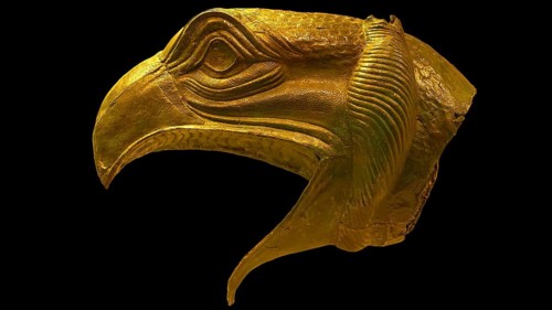 Bronze griffin protome, majestic eagle head figure in golden sculpture with fine details, Olympia