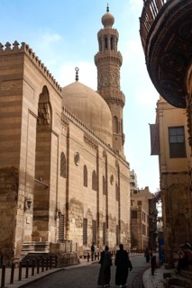 Cairo, Egypt. July 7th 2024 Locals and tourists walk past one of the many restored monuments along