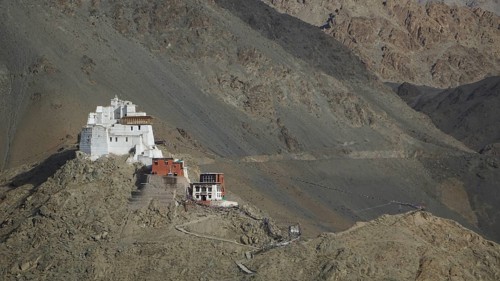 Hike to Namgyal Tsemo Buddhist monastery, perched on a rocky mountain in the midst of bare