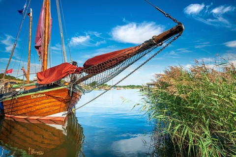 Traditional wooden sailboat in the harbor on the ferry of Moritzdorf, OT of Sellin, Mönchgut