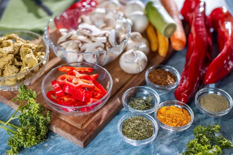 Fresh ingredients such as peppers, carrots and mushrooms in addition to spices and herbs