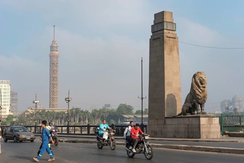 Cairo, Egypt. July 1st 2024 A view of Qasr El Nil Bridge and Cairo Tower with early morning traffic