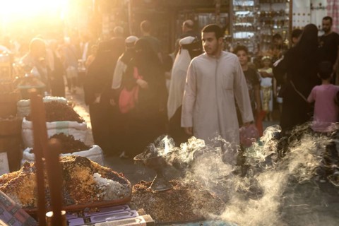 Cairo, Egypt. July 2nd 2024 Smoke from burning incense in a busy market in the historical Islamic