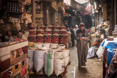 Cairo, Egypt. July 1st 2024 An Egyptian man walking in the narrow streets of the spice market a