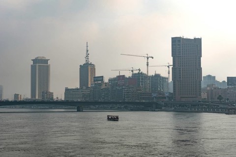 Cairo, Egypt. July 1st 2024 Building and construction cranes of the Cairo city skyline seen through