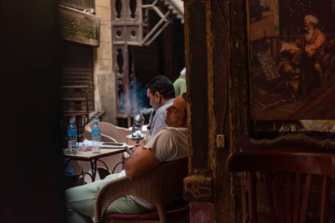 Cairo, Egypt. June 24th 2024 An Egyptian man sleeps in a Downtown Cairo coffee shop during the