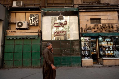 Cairo, Egypt. June 14th 2024 Typical Downtown Cairo street scene as an Egyptian man walks past