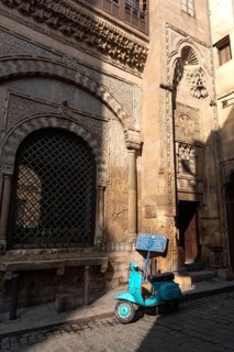 Cairo, Egypt. December 21st 2022 Vespa motor scooter outside Sabil-Kuttab of Katkhuda, in Al Muizz