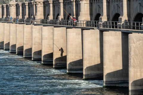 Qanater, Nile Delta. Egypt. December 18th 2022 Egyptian men fishing from the El Qanater Barrage, on