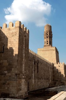 Cairo, Egypt, November 26th 2022 Minaret of the Al Hakim Mosque with the fortified defensive