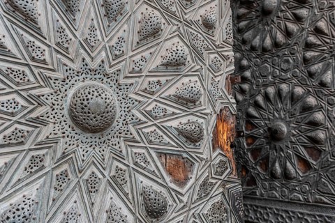 Beautiful Islamic geometric designed ancient wooden door of historical monument in the Egyptian
