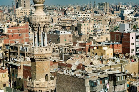 Cairo, Egypt. November 29th 2022 Mosque minaret in front of crowded aerial cityscape view of Cairo,