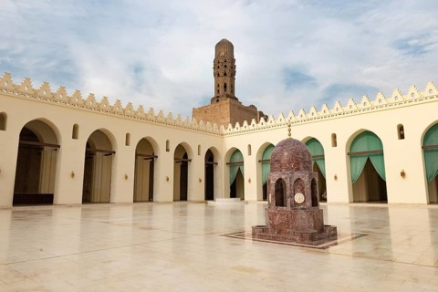 Cairo, Egypt, November 26th 2022 Minaret and ablutions fountain of historic Mosque of al-Hakim,