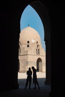 Cairo, Egypt. November 29th 2022 Tourists inside the courtyard and dome of Ibn Tulin Mosque in