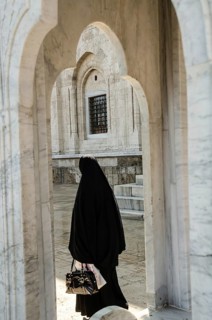 Bursa, Turkey. April 21st 2014 A Muslim women visiting the Grand Mosque of Bursa city in Turkey