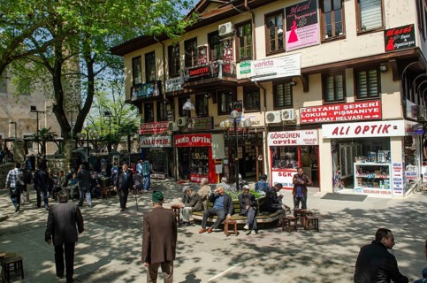 Bursa, Turkey. April 21st 2014 Older people relaxing in a tree shaded square, Bursa city, Turkey