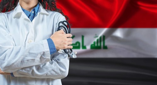 Healthcare professional with Iraq flag background. Professional doctor holding stethoscope on Iraq